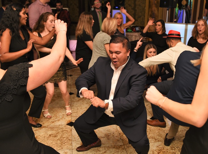 Guests in a dance-off at a corporate party.